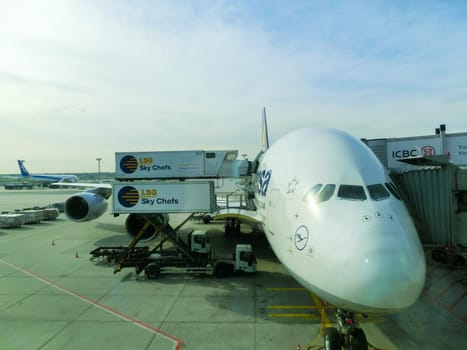 Frankfurt am Mine, Germany - April 30, 2016: Aircraft standing near the terminal at Frankfurt am Main airport. It is a one of the busiest airport in Europe.