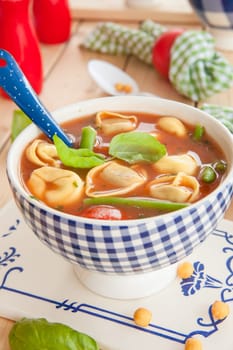 Rustic tomato soup with vegetables and tortellini