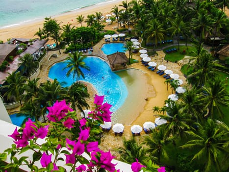 The top view of luxury tropical hotel resort with pool