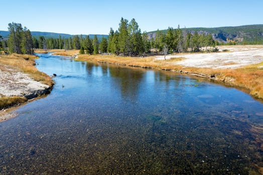 View of the Firehole River as it meanders through the Upper Geyser Basin in Yellowstone National Park