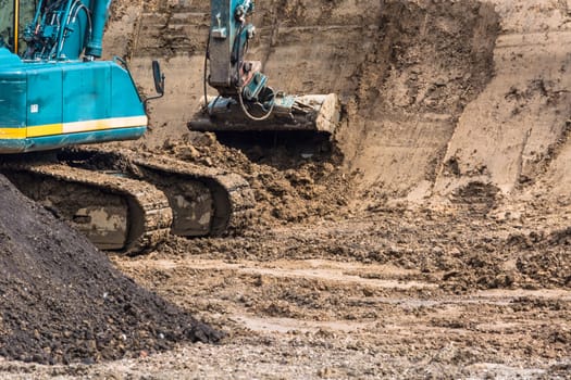 Close-up view of a construction site with excavator.