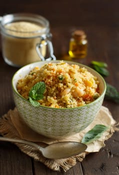 Couscous with shrimps and vegetables in a bowl