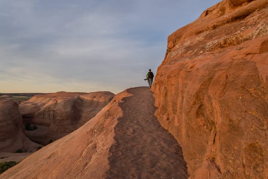 Photographer in the desert of Moab prepares for shooting, Moab. UTAH