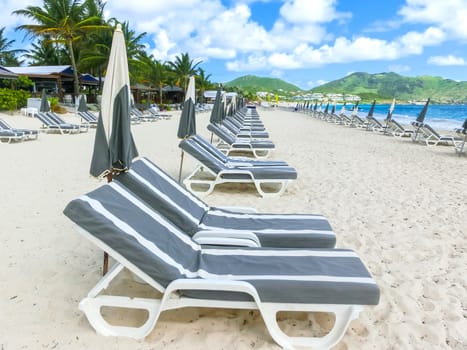 The chairs and umbrellas on Caribbean tropical beach