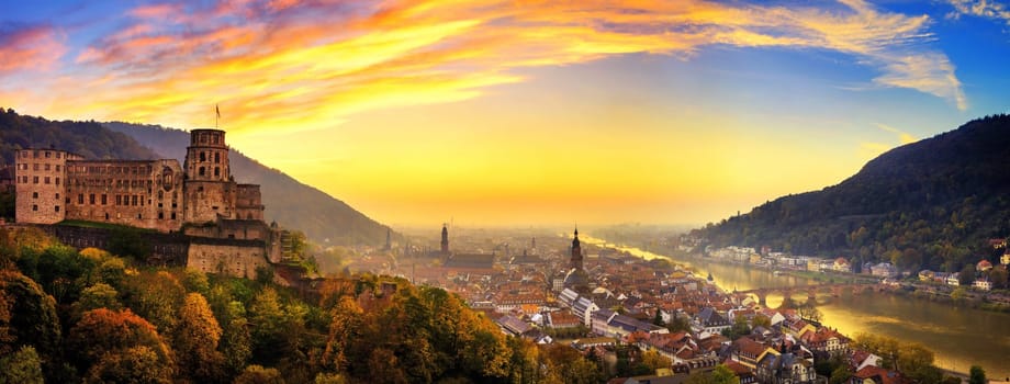 Heidelberg,Germany,aerial panoramic view at dusk,with colorful sunset sky,the castle,Neckar river and the Old Bridge
