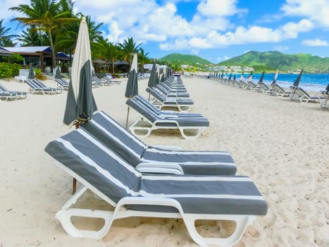 The chairs and umbrellas on Caribbean tropical beach