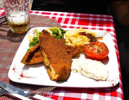 Tripe typical French food. On a rustic table at Lyon