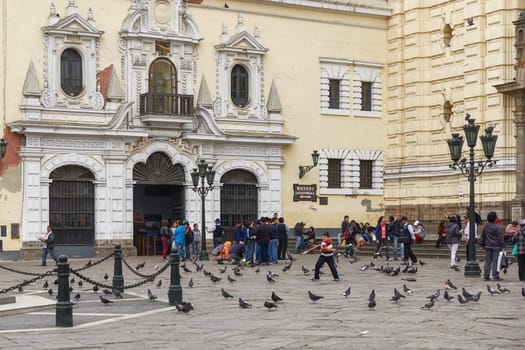 People Waiting to Visit Monastery of San Francisco in Lima, Peru. The church contains a museum and catacombs which are popular place to visit by tourists.