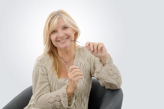 a portrait of mature smiling blond woman