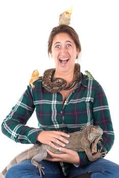 Girl with several pet animals isolated in white