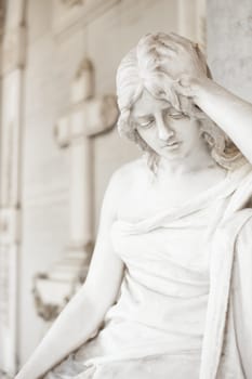 More than 100 years old statue. Cemetery located in North Italy.