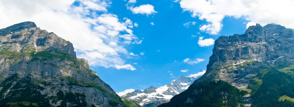 Swiss Alps - snow capped mountains and deep valleys, stunning view, breath-taking panorama