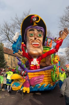 OLDENZAAL, NETHERLANDS - FEBRUARY 7, 2016: Unknown people joining the annual carnival parade with a decorated wagon