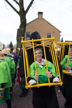 OLDENZAAL, NETHERLANDS - FEBRUARY 7, 2016: Unknown person in funny carnival outfit during the annual carnival parade