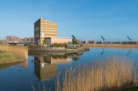 modern house in a small lake in the netherlands