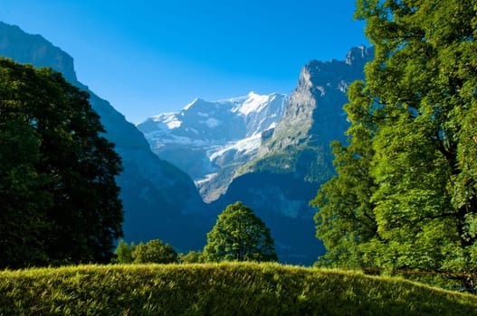 Swiss Alps - snow capped mountains and deep valleys, stunning view, breath-taking panorama
