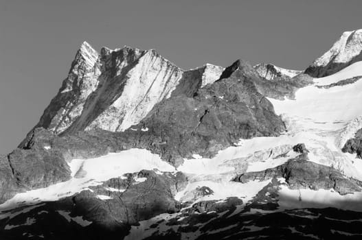 Swiss Alps - snow capped mountains and deep valleys, stunning view, breath-taking panorama