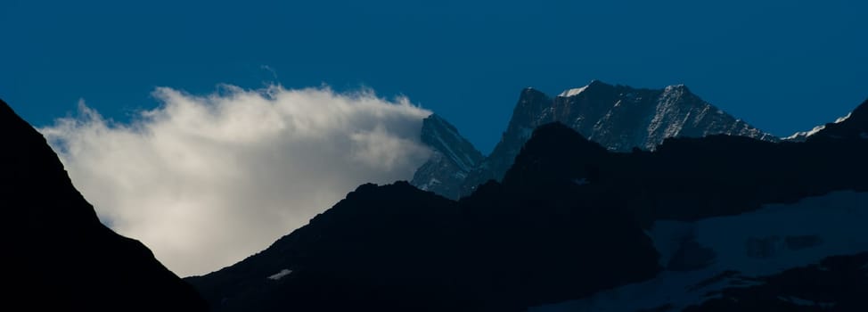 Swiss Alps - snow capped mountains and deep valleys, stunning view, breath-taking panorama