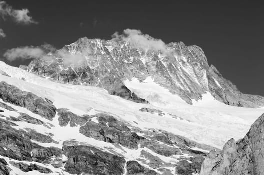 Swiss Alps - snow capped mountains and deep valleys, stunning view, breath-taking panorama