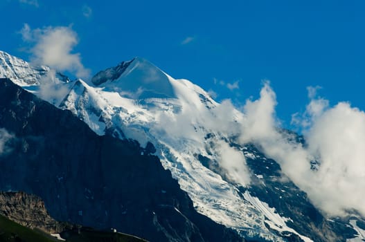 Swiss Alps - snow capped mountains and deep valleys, stunning view, breath-taking panorama