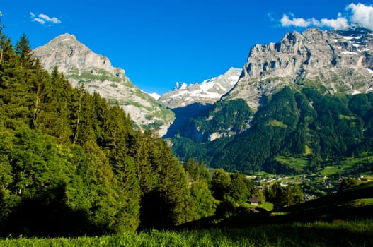 Swiss Alps - snow capped mountains and deep valleys, stunning view, breath-taking panorama