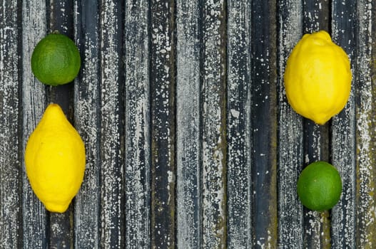 Raw textured black Background backdrop with lemon and lime and copy space outdoor