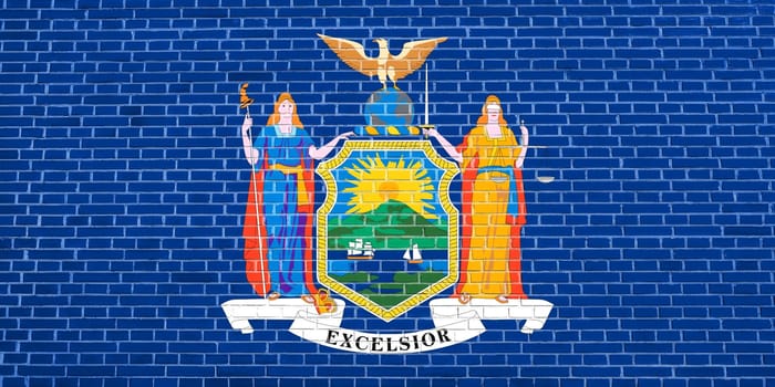 New Yorker official flag, symbol. American patriotic element. USA banner. United States of America background. Flag of the US state of New York on brick wall texture background