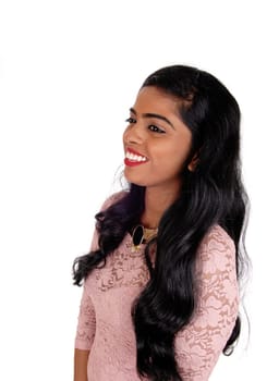 A portrait image of a beautiful Indian woman with long black.hair standing in profile, isolated for white background..