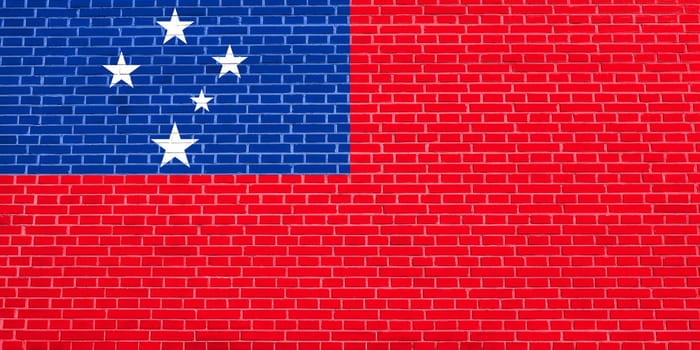 Samoan national official flag. Patriotic symbol, banner, element, background. Accurate dimensions. Correct size, colors. Flag of Samoa on brick wall texture background