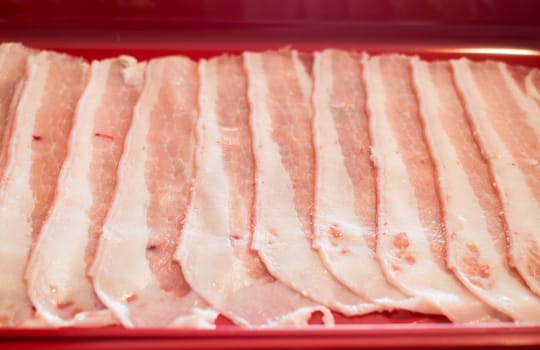 Raw sliced pork preparing for homemade sukiyaki, stock photo