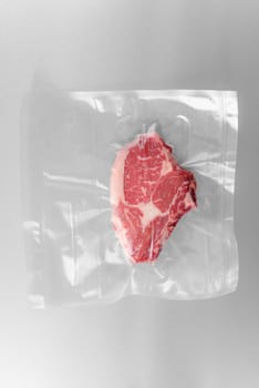 Vacuum sealed fresh rib eye steak for sous vide cooking