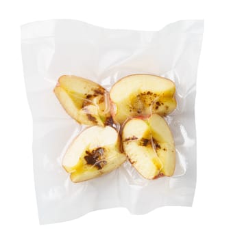Vacuum sealed fresh apricots with cinnamon for sous vide cooking cutout on white