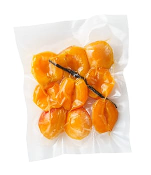 Vacuum sealed fresh apricots with vanilla for sous vide cooking cutout on white
