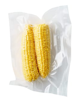 Vacuum sealed fresh corncobs for sous vide cooking cutout on white
