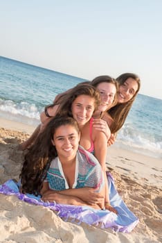 Group of happy teenage girls at the beach