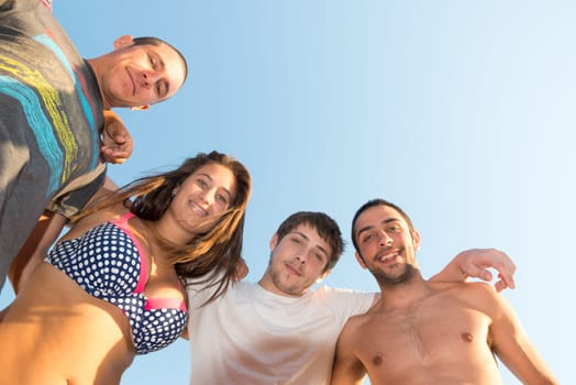 Group of happy teenage friends at the beach