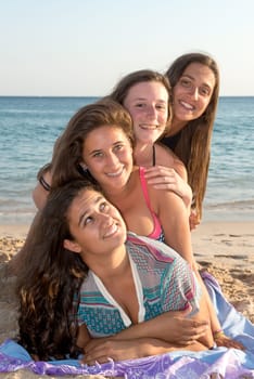 Group of happy teenage girls at the beach