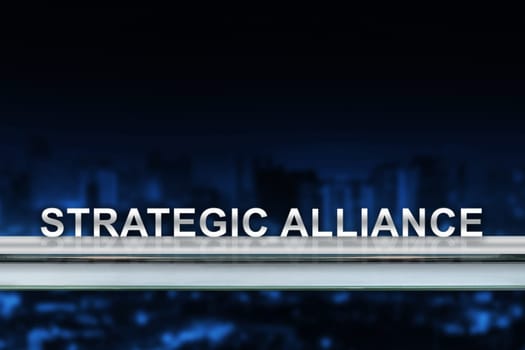 strategic alliance on metal railing with blurred background