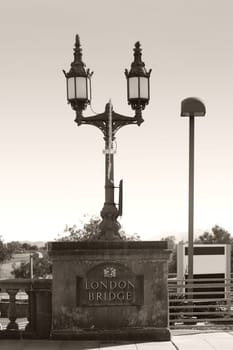 A pillar of the London Bridge in Lake Havasu City with a lantern.