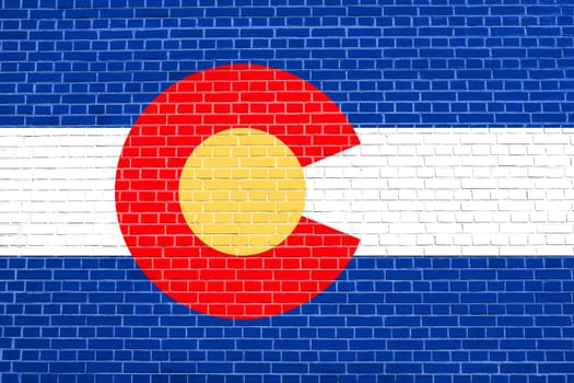Colorado official flag, symbol. American patriotic element. USA banner. United States of America background. Flag of the US state of Colorado on brick wall texture background