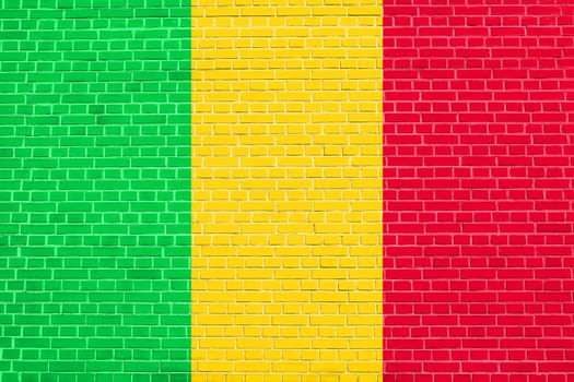 Malian national official flag. African patriotic symbol, banner, element, background. Flag of Mali on brick wall texture background