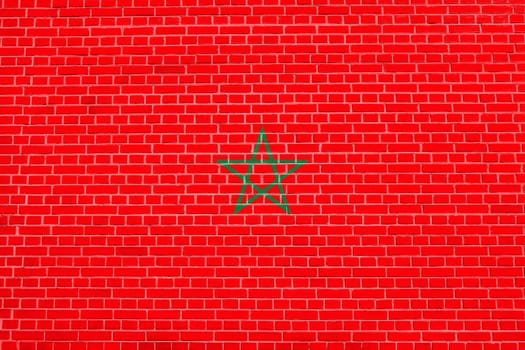 Moroccan national official flag. African patriotic symbol, banner, element, background. Flag of Morocco on brick wall texture background
