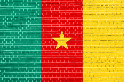 Cameroonian national official flag. African patriotic symbol, banner, element, background. Flag of Cameroon on brick wall texture background