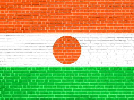 Nigerien national official flag. African patriotic symbol, banner, element, background. Flag of Niger on brick wall texture background
