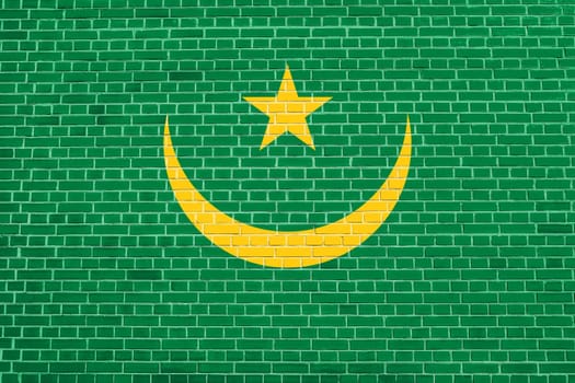 Mauritanian national official flag. African patriotic symbol, banner, element, background. Flag of Mauritania on brick wall texture background