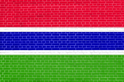 Gambian national official flag. African patriotic symbol, banner, element, background. Flag of the Gambia on brick wall texture background