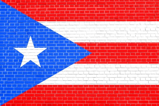 Puerto Rican national official flag. Patriotic symbol, banner, element, background. Flag of Puerto Rico on brick wall texture background