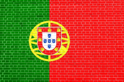Portuguese national official flag. Patriotic symbol, banner, element, background. Flag of Portugal on brick wall texture background