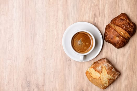 german baps with coffee on wooden ground from above