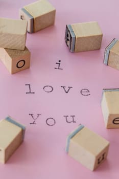 I love you with stamps on pink background